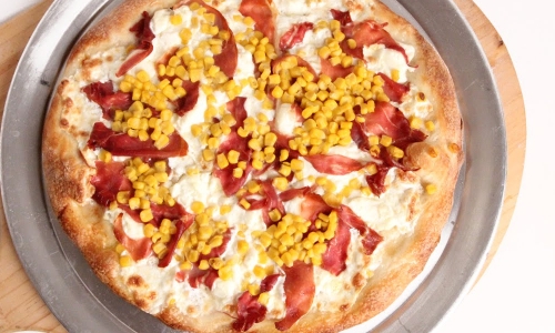 Corn Prosciutto and Ricotta Pizza